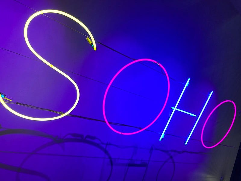 A neon sign saying Soho