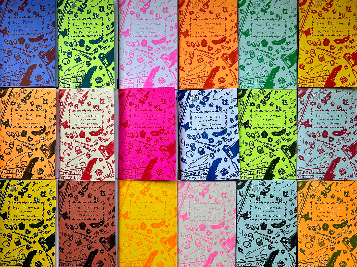 Photograph of eighteen multi-colored, printed copies of the zine “Fan Fiction” laid flat in a tight grid. 