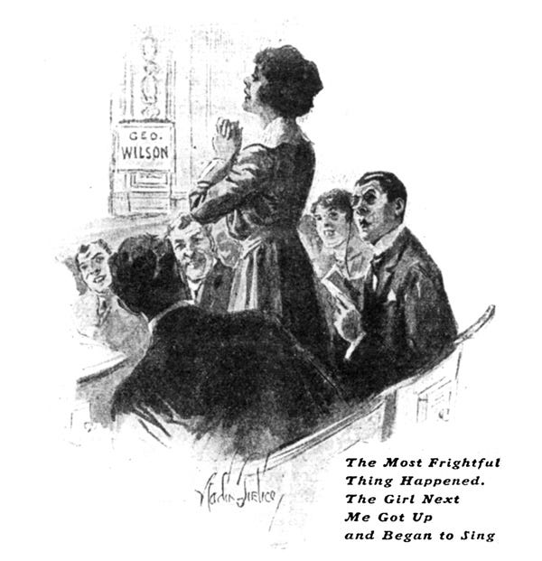 Bertie, and the theatregoers around him, look aghast at a woman standing from her seat and singing. Her hands are clasped in front of her chest, held up as though begging, and she is looking wistfully out to the stage. A sign reading “Geo. Wilson” is visible on stage. The caption reads, "The most frightful thing happened. The girl next me got up and began to sing".