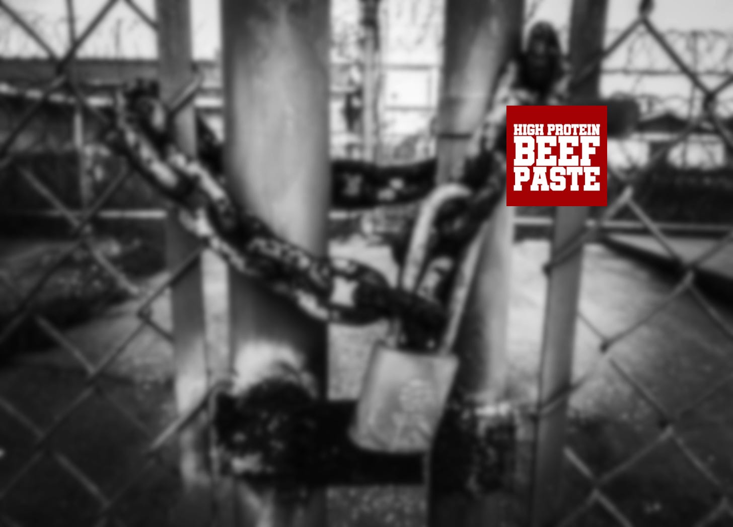 High Protein Beef Paste logo on a photo of a padlocked gate