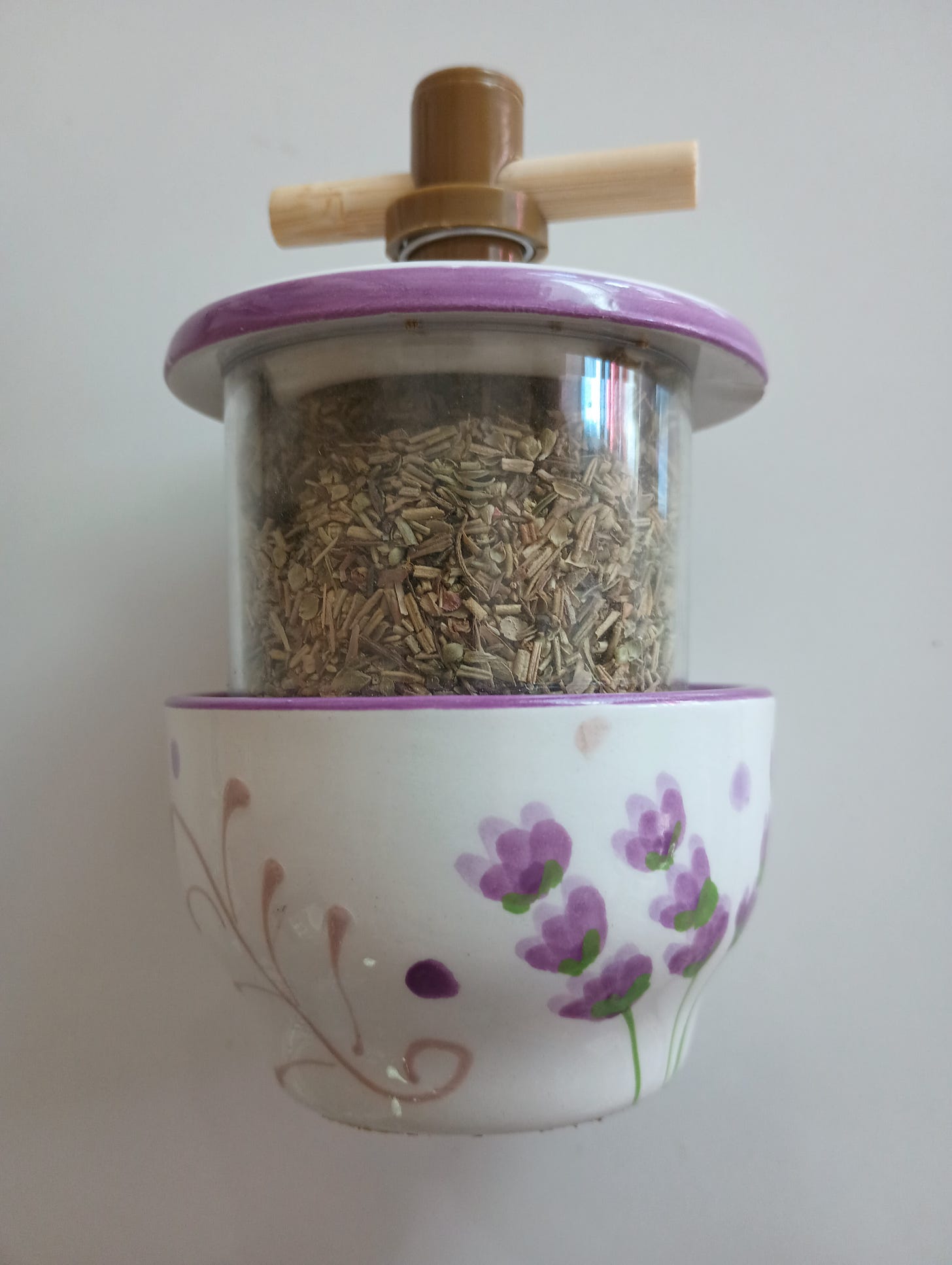 spice grinder with image of lavender and leaves