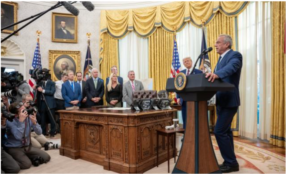 Wisconsin Senator Ron Johnson stands between Sen. Rand Paul and Rep. Marjorie Taylor Greene, just behind the Oval Office desk at RFK Jr.’s swearing-in ceremony.