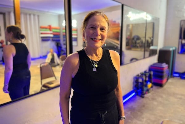 woman in tank top poses in workout room cloudcroft woman in tank top poses in workout room cloudcroft