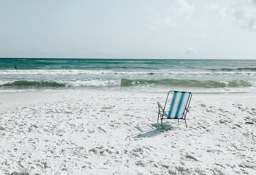 black armchair on seashore