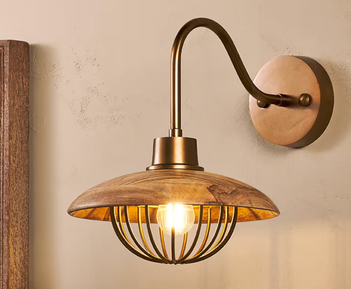 wall light with bird cage effect over the bulb with wooden shade