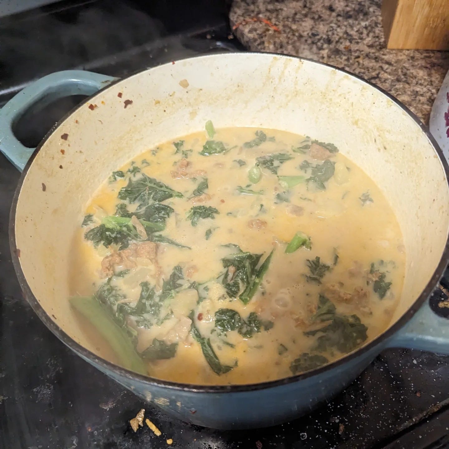an image of zuppa toscana, homemade, in a dutch oven