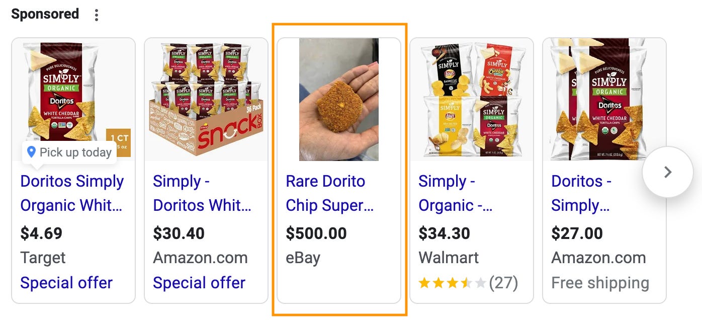 Google search results; there are 5, and the one in the center is an image of a hand with a big orange blob in it that says "Rare Dorito Chip Super..." and is listed for $500 on eBay. The other 4 listings are for the Organic White Cheddar Doritos.