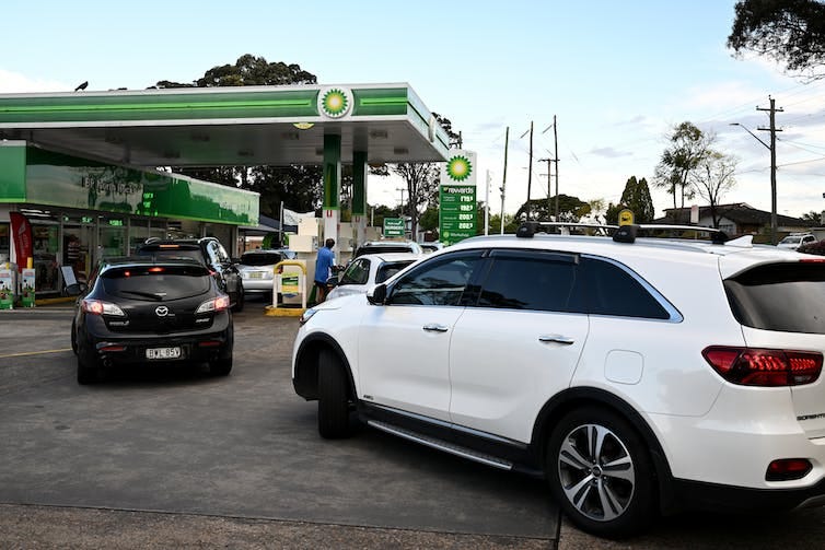 cars queuing up at petrol station