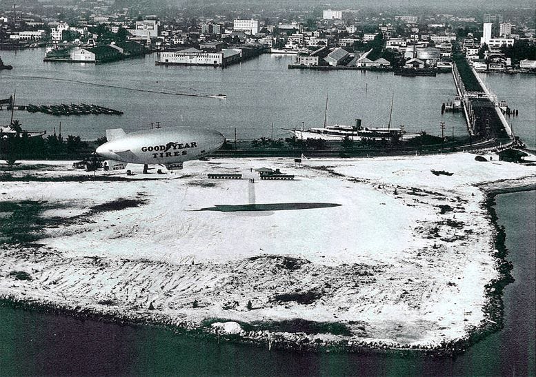 Aerial of Causeway Bend Island and the Goodyear Blimp in April of 1934. 