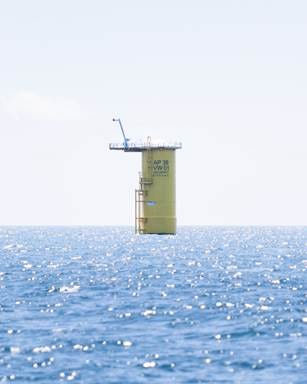 A tower in the middle of the ocean

Description automatically generated