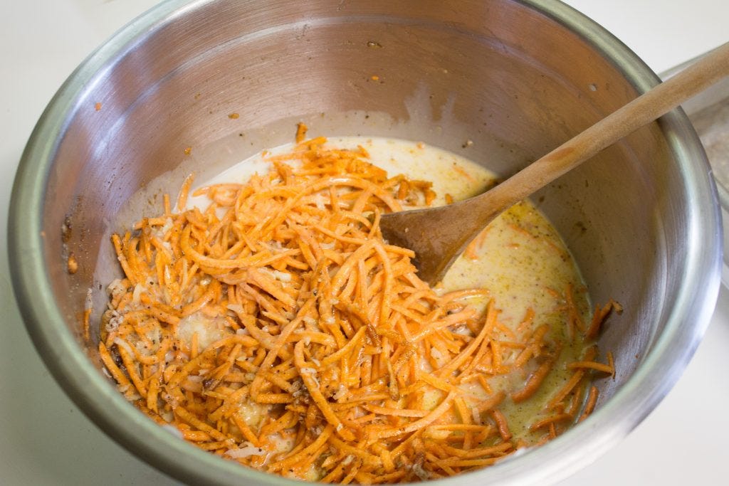 Mixing together all the ingredients in a big bowl. 