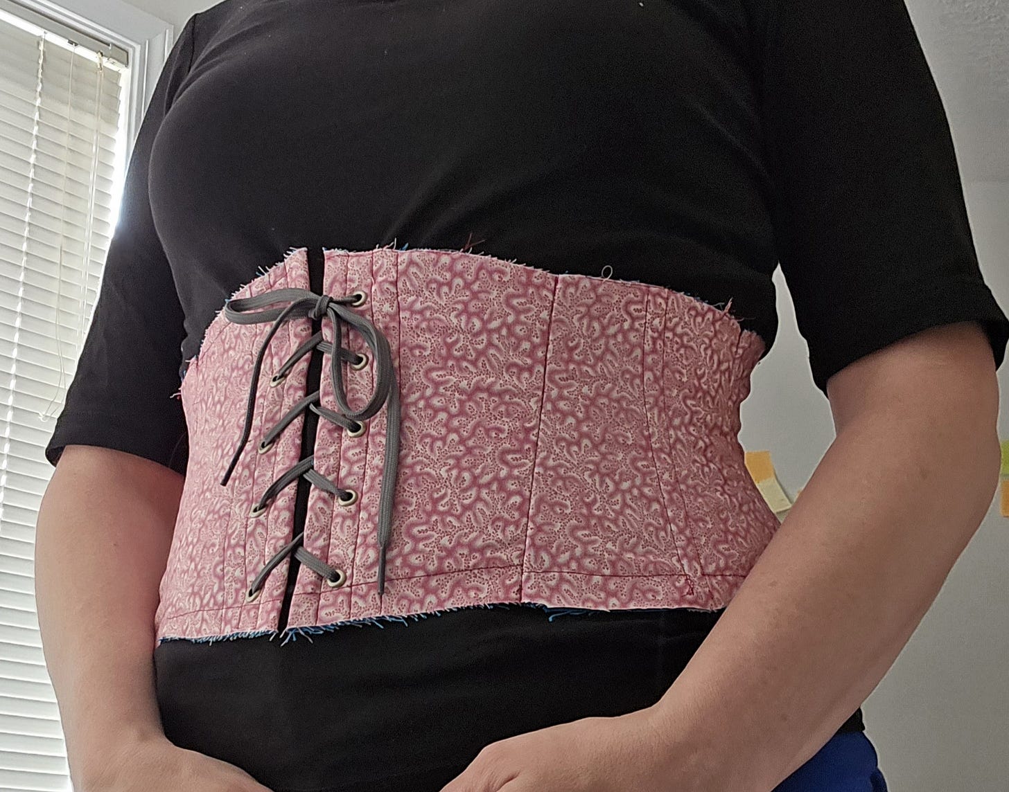 The author in a stomacher - a short corset that just goes around the waist