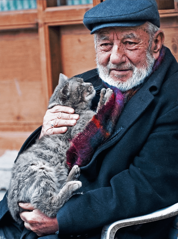 Old Turkish man holding his cat : r/cats