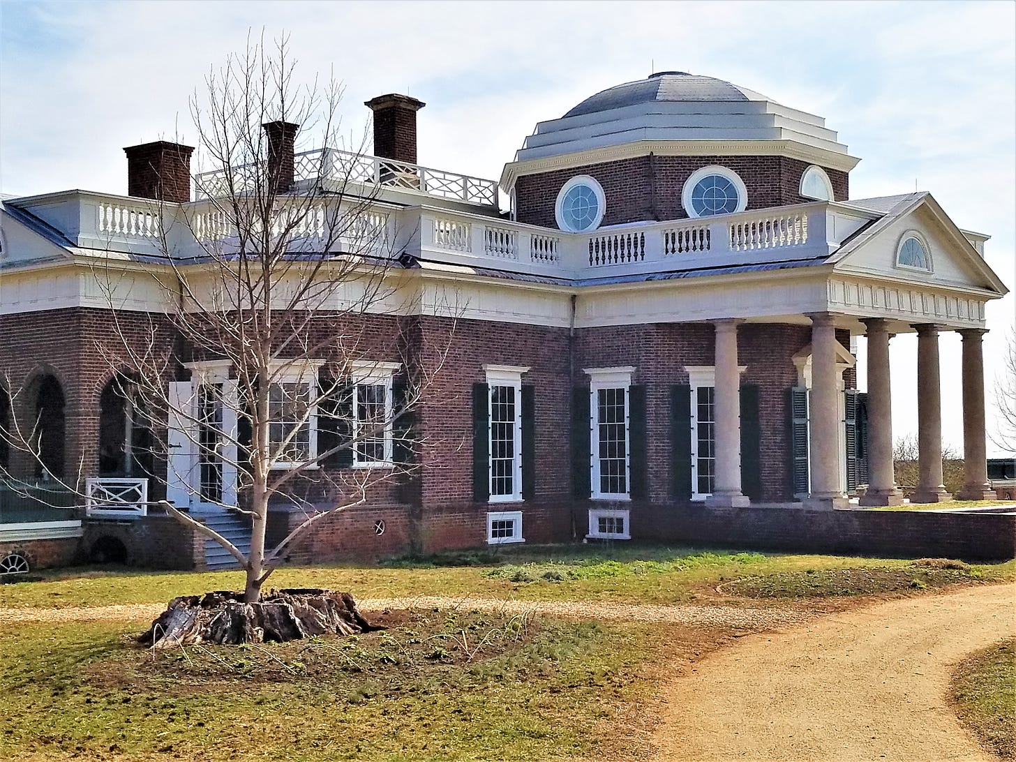 Monticello, a brick house with pillars on the front porch.
