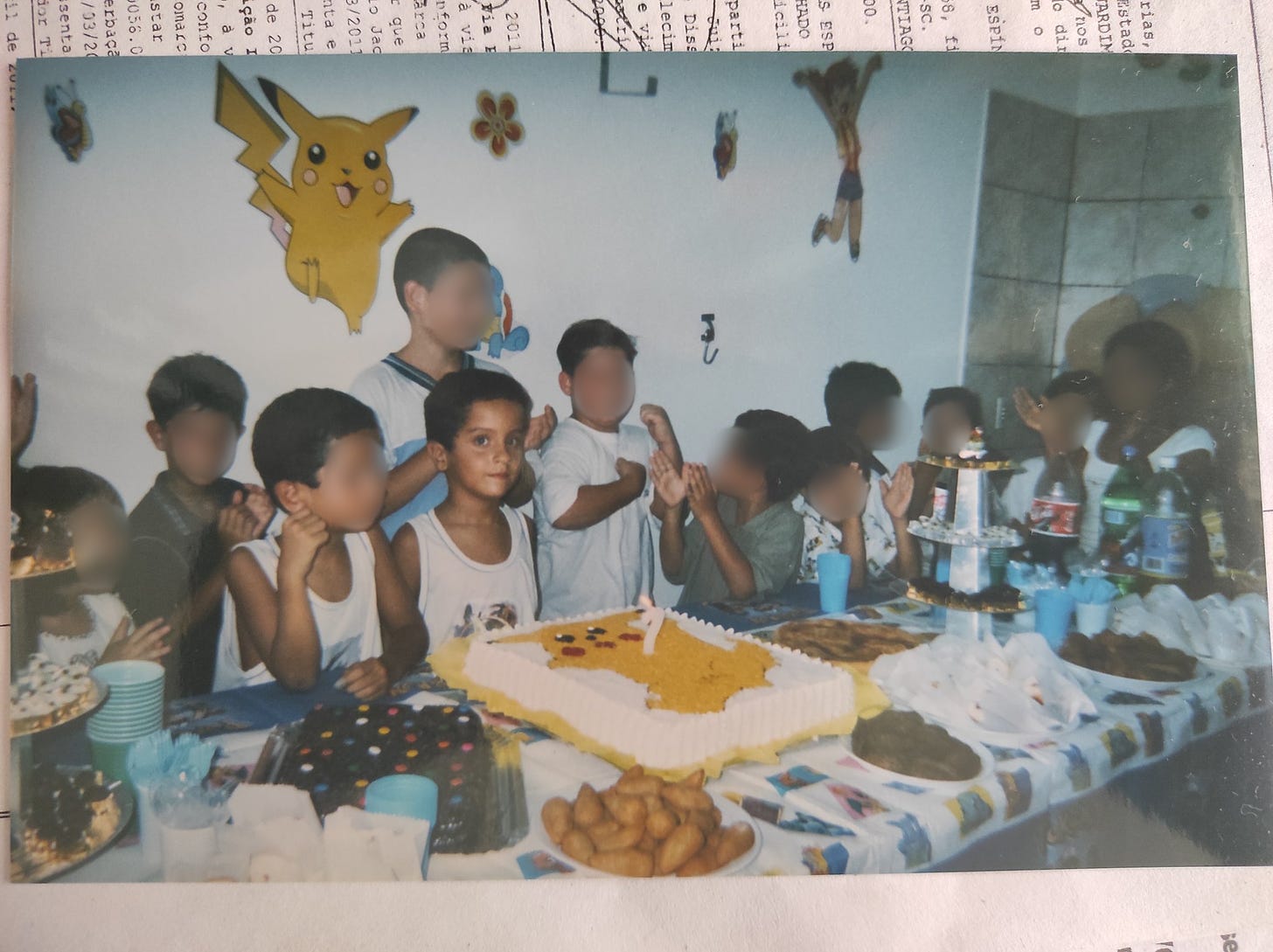 Rikki at his Pokémon-themed party on his seventh birthday in 1998. We are super jealous of that Pikachu cake!