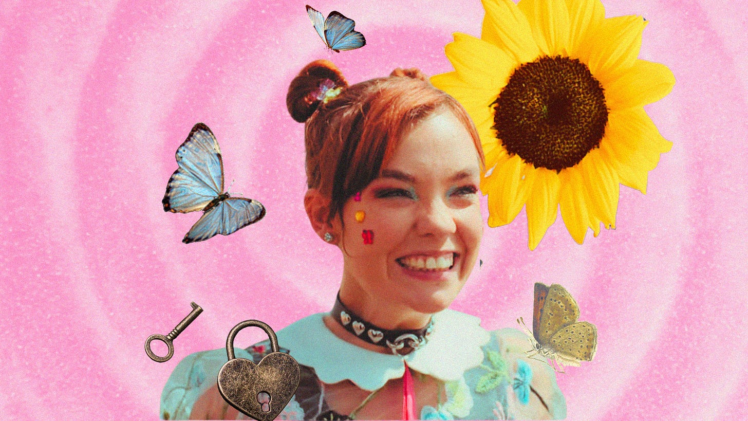 Quinni from Heartbreak High wears space buns and a cheesy grin. There are butterflies, a sunflower and lock and key surrounding her image against a pink background.