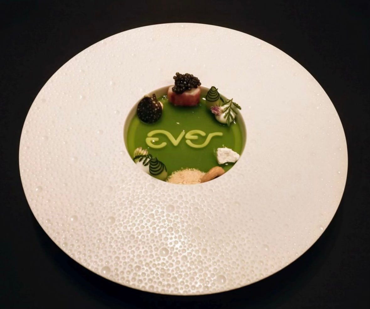 A dish from Ever with the restaurant's name spelled out with some kind of vegetable.