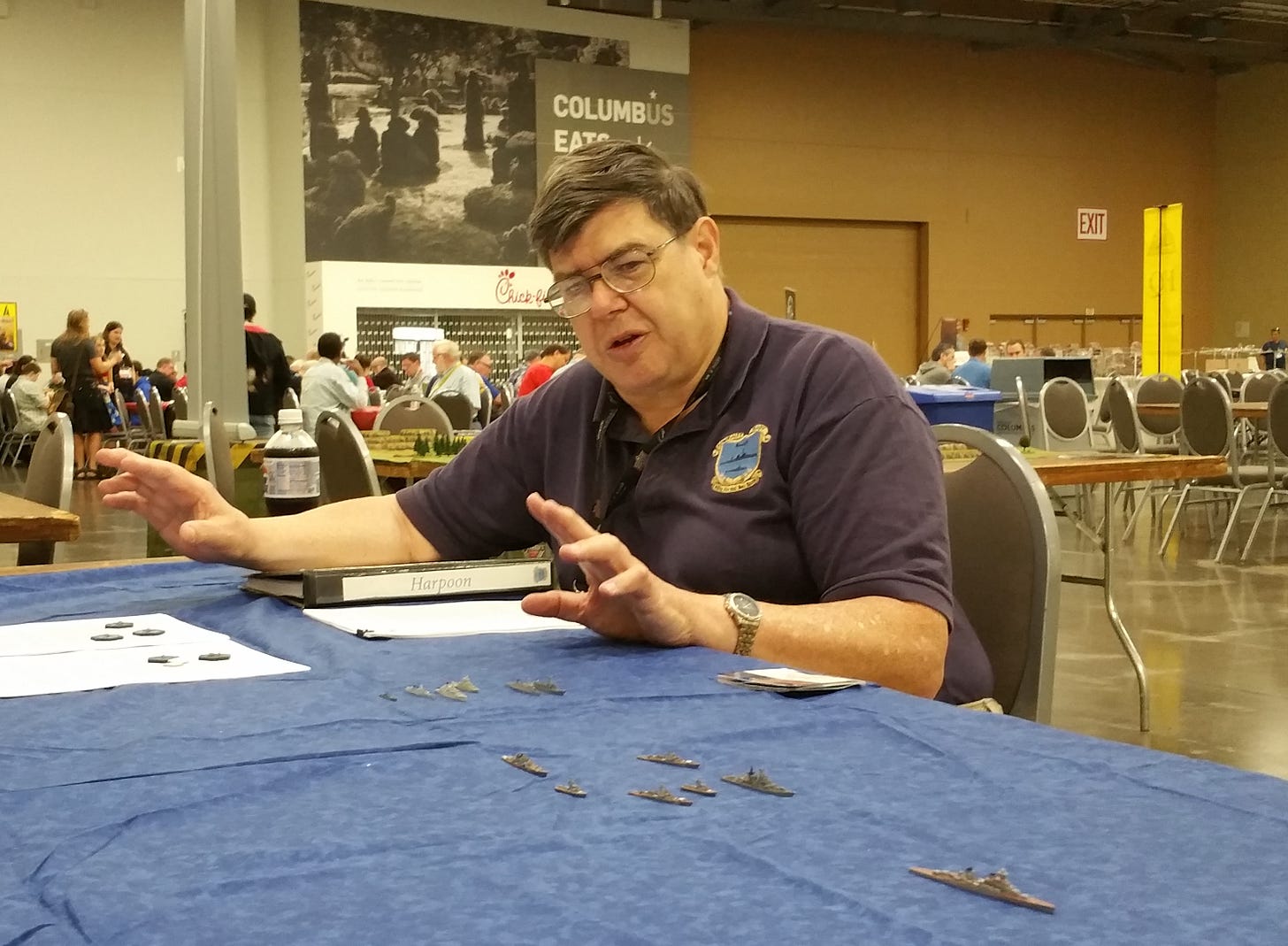 Larry Bond plays the table version of Harpoon at a convention in 2018