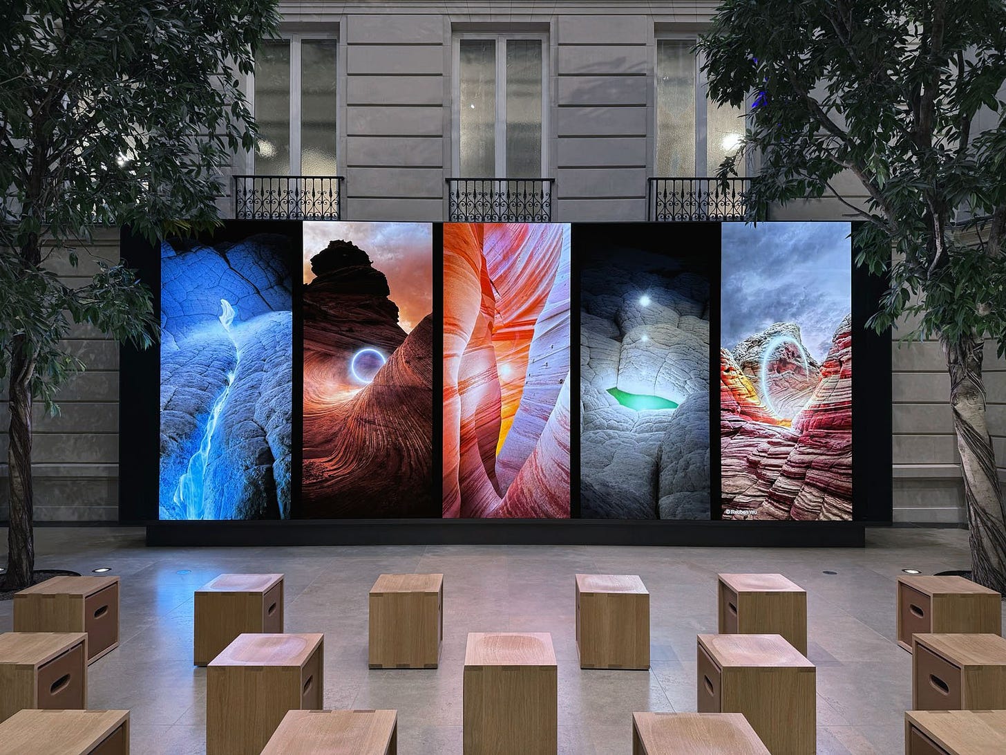 Photos shot on iPhone 15 Pro are displayed on the video wall at Apple Champs-Élysées.