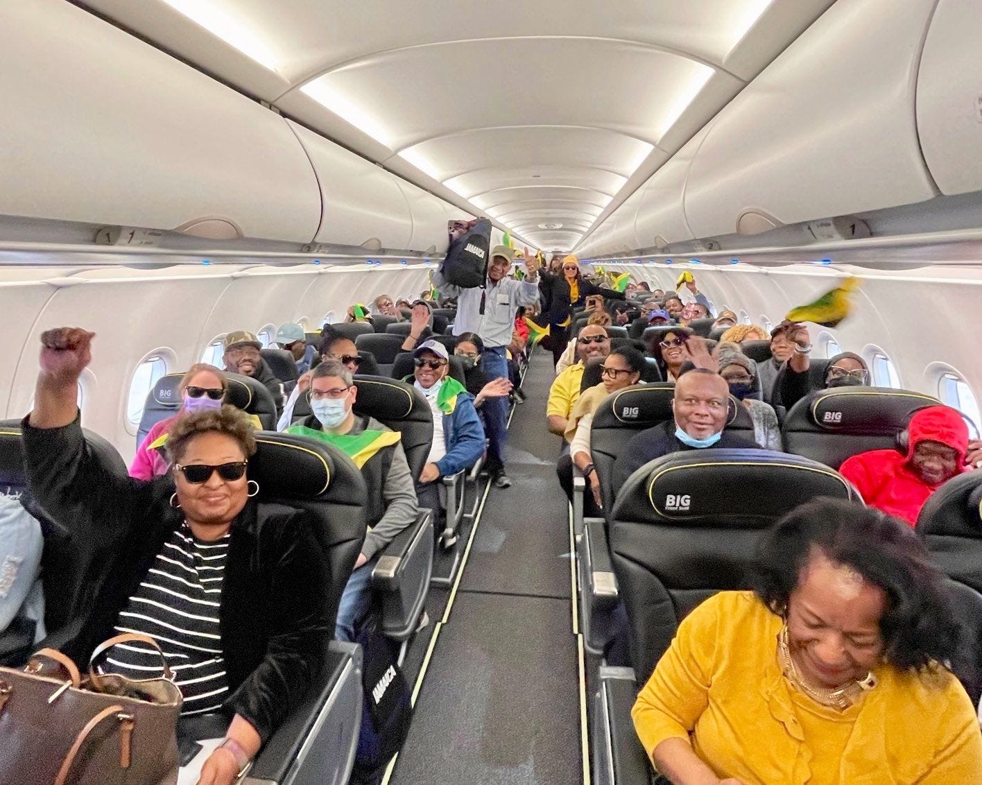 An ecstatic group of travelers after finding a great deal to Jamaica via Spirit