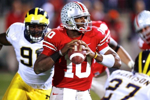 Ohio State quarterback Troy Smith in the pocket with a Michigan defender closing in during the 2006 edition of their rivalry "The Game"