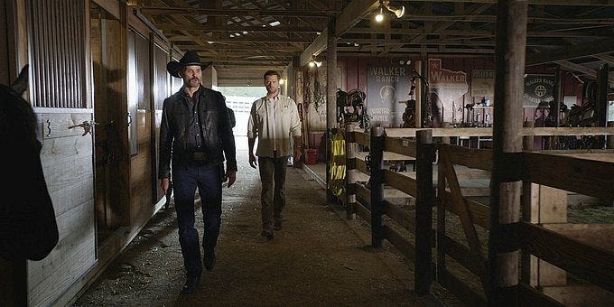 Walker Clint and Cordell walking in barn.