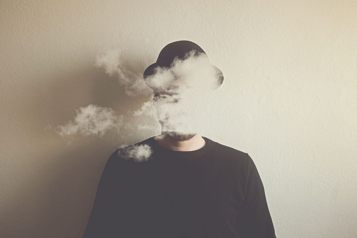 Man with Smoke Obscuring Face to Represent Behind the Scenes: The Gell-Mann Amnesia Effect