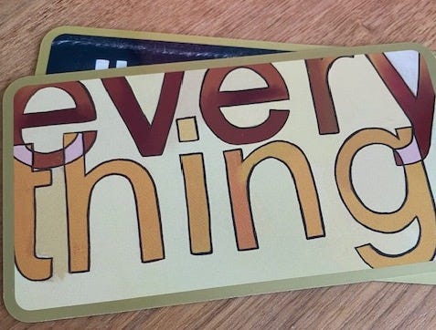 Image of a card that reads "everything".