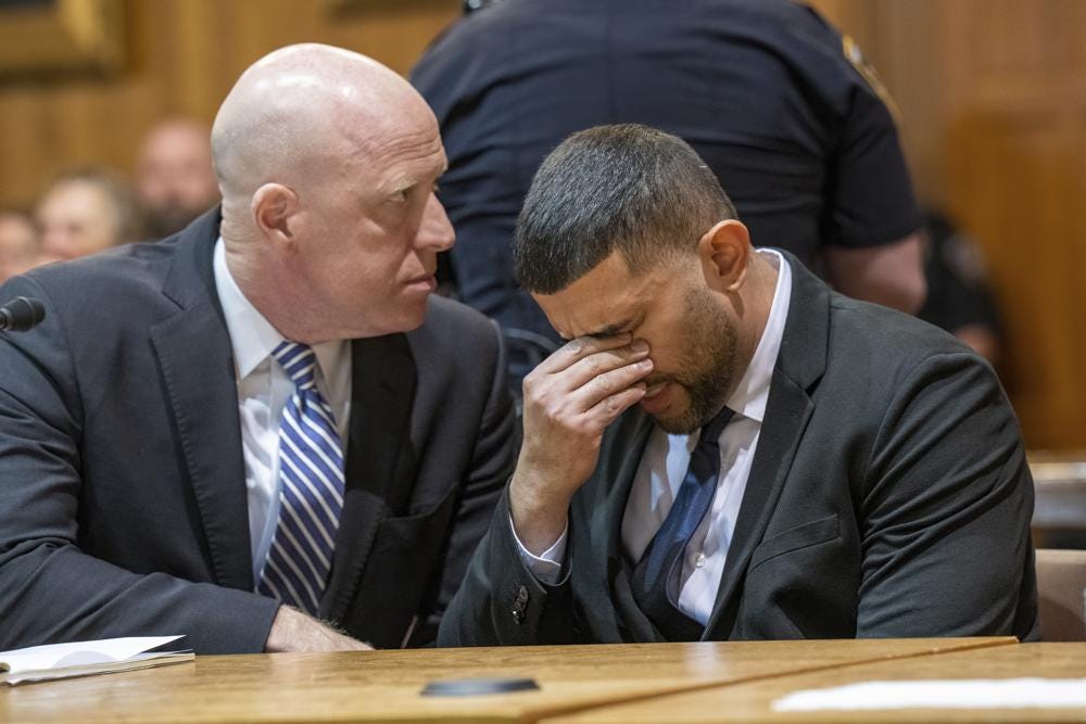 Nauman Hussain, right, sitting with his attorney Lee Kindlon, reacts as the verdict is read in his trial, Wednesday, May 17, 2023, at Schoharie County Court in Schoharie, N.Y. Hussain, a limousine service manager, was convicted of manslaughter Wednesday in a crash that killed 20 people in rural New York, one of the deadliest U.S. road wrecks in two decades. (Jim Franco/The Albany Times Union via AP)