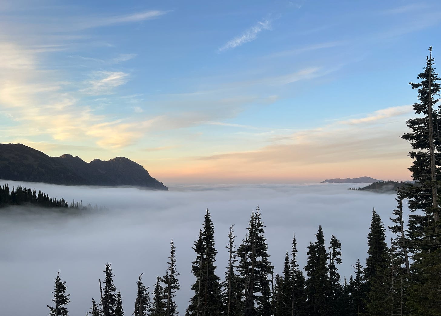 Cloud inversion in mountains at sunset