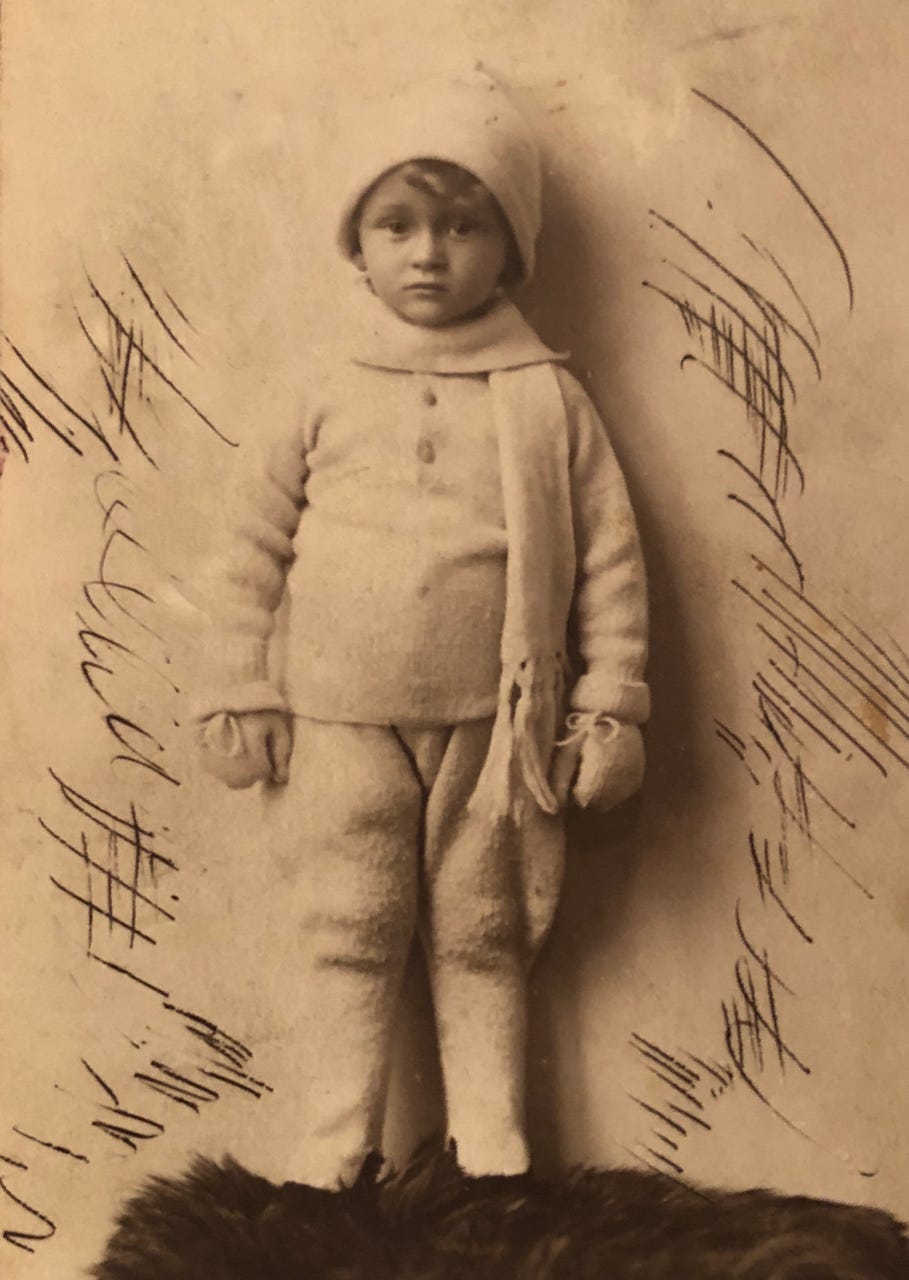 Sepia-toned image of my Vati as a young boy, dressed in sweater, cap and scarf