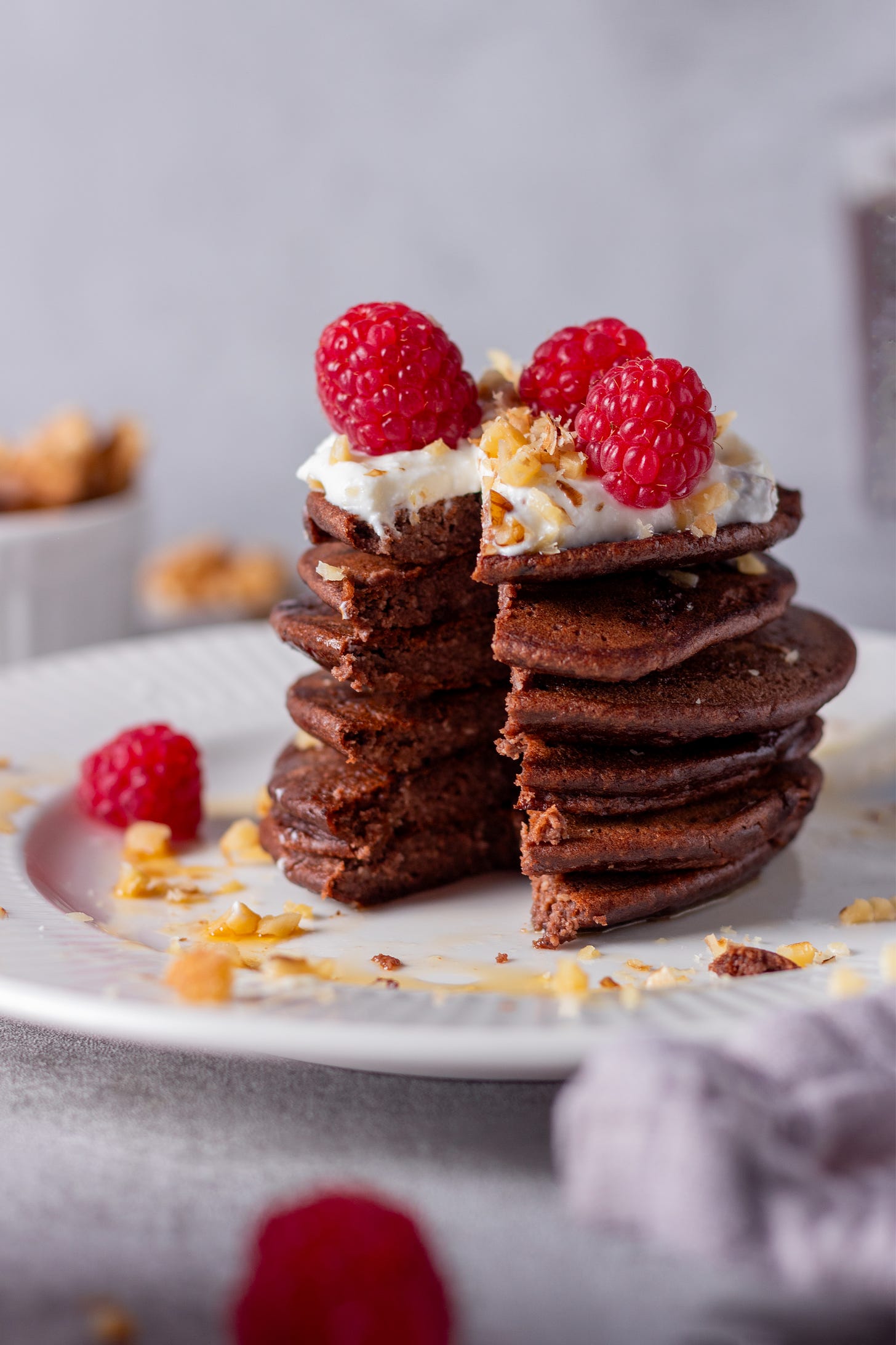 Stack of pancakes with a slice cut out.