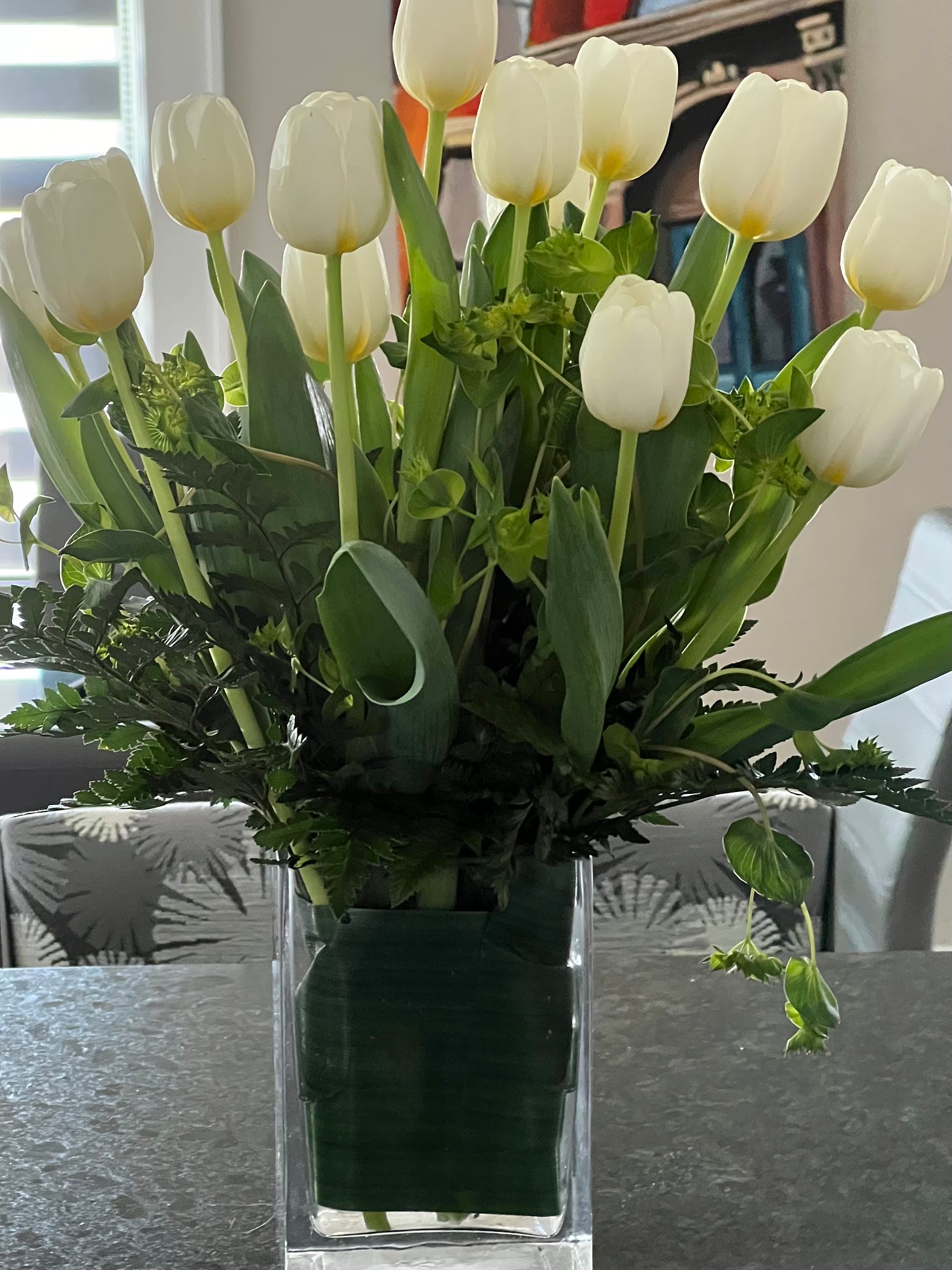 Vase full of white tulips