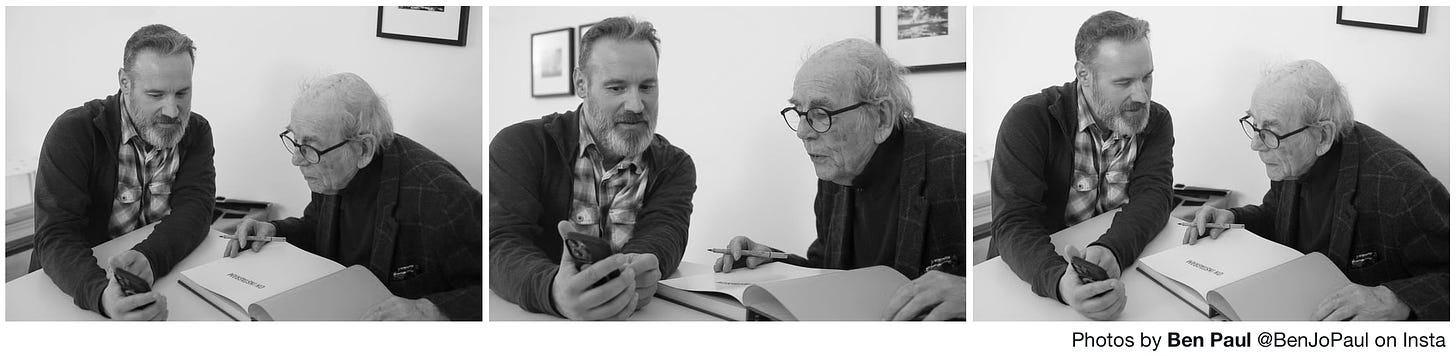 Three photograph side-by-side of myself talking with the photographer David Hurn at the Magnum offices in London.