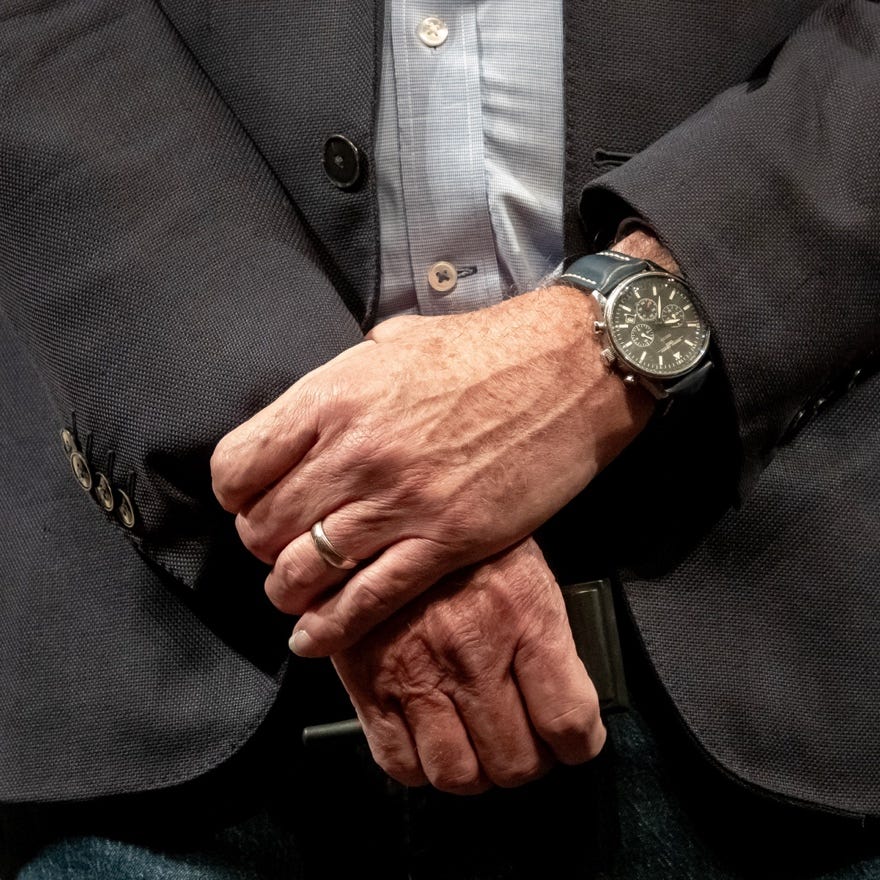A close-up of a person's hands

Description automatically generated