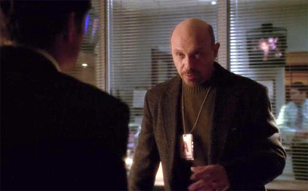 Hector Elizondo as Dr. Millgate in The West Wing, explaining that scientific research rarely starts with a marketable objective.