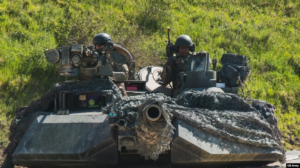 FILE - US soldiers in an M1 Abrams tank conduct vehicle movements as part of an exercise at the Hohenfels Training Area, Germany June 2, 2022.