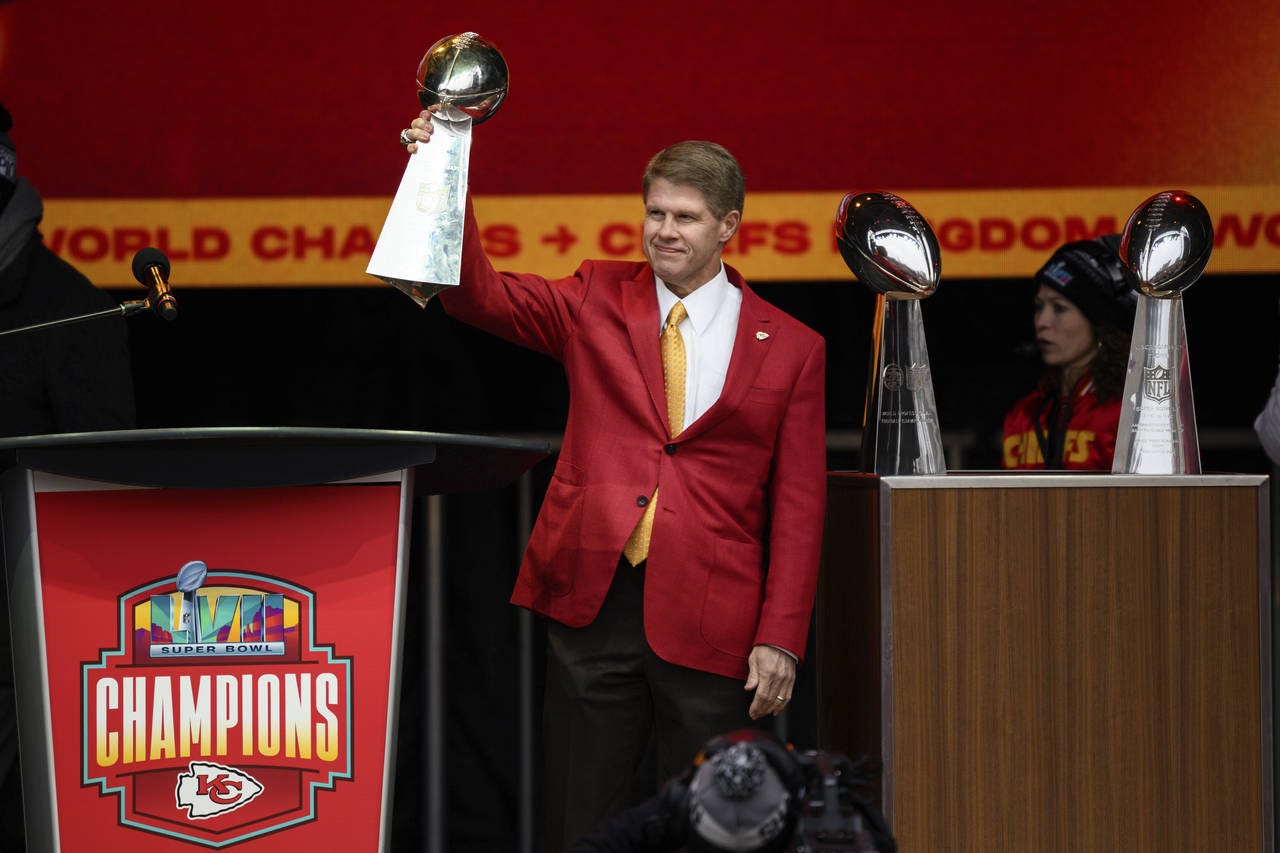 
              Kansas CIty Chiefs Chairman and CEO Clark Hunt brings out the new Super Bowl trophy to join the first two during the Kansas City Chiefs' victory celebration in Kansas City, Mo., Wednesday, Feb. 15, 2023. The Chiefs defeated the Philadelphia Eagles in the NFL Super Bowl 57 football game. (AP Photo/Reed Hoffmann)
            