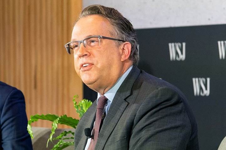 A person in a suit and tie

Description automatically generated with medium confidence
