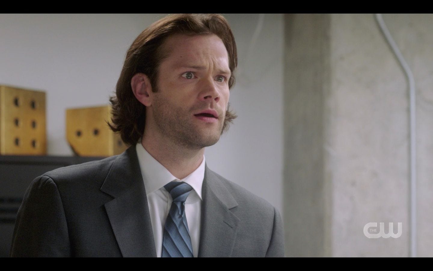 Sam Winchester suited up with Dean in office SPN 14.20