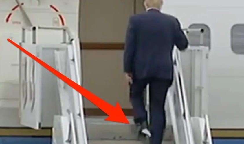 Donald Trump climbs the stairs to Air Force One with something stuck to the heel of his shoe. 