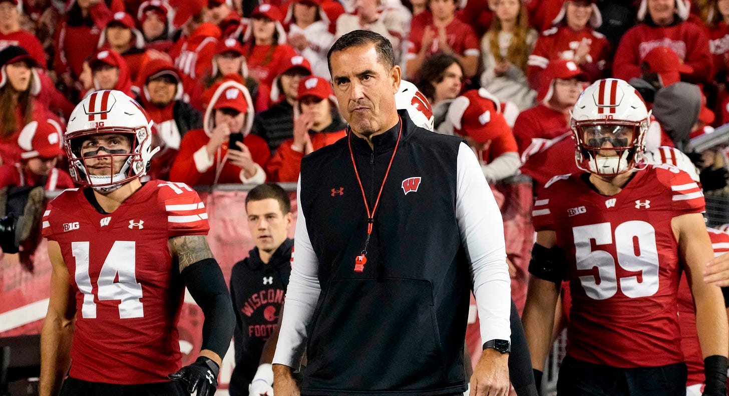 Wisconsin Badgers head coach Luke Fickell leads the team onto the field at Camp Randall Stadium