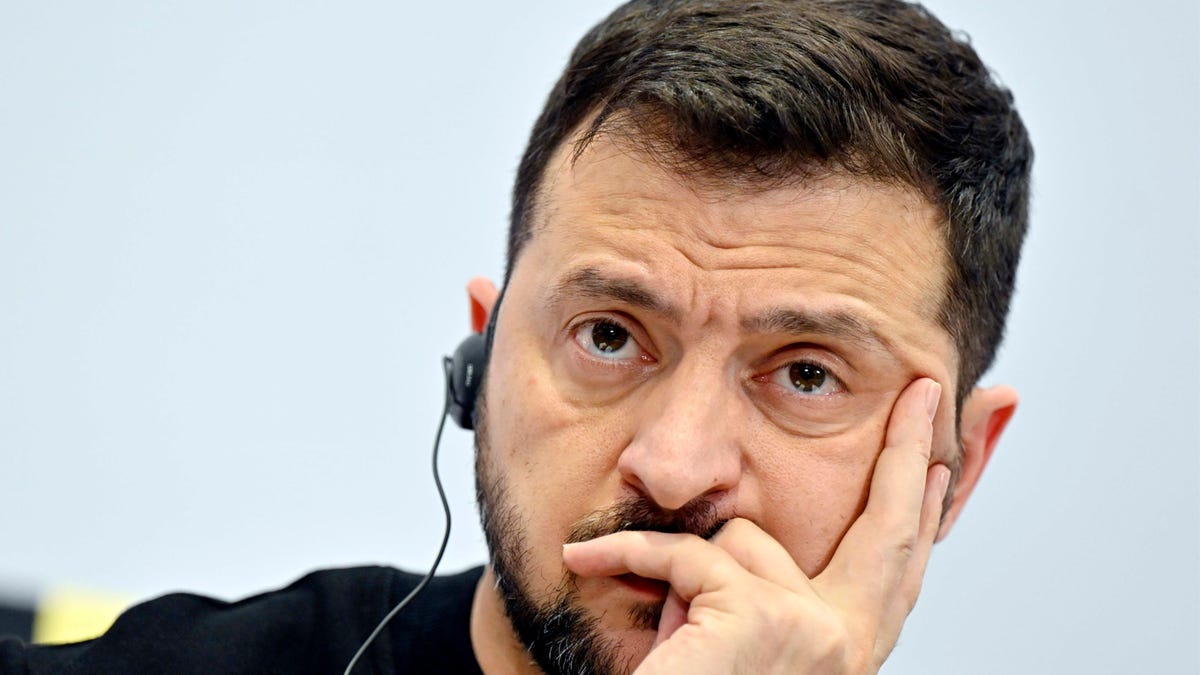 Zelenskyy listening with headphones