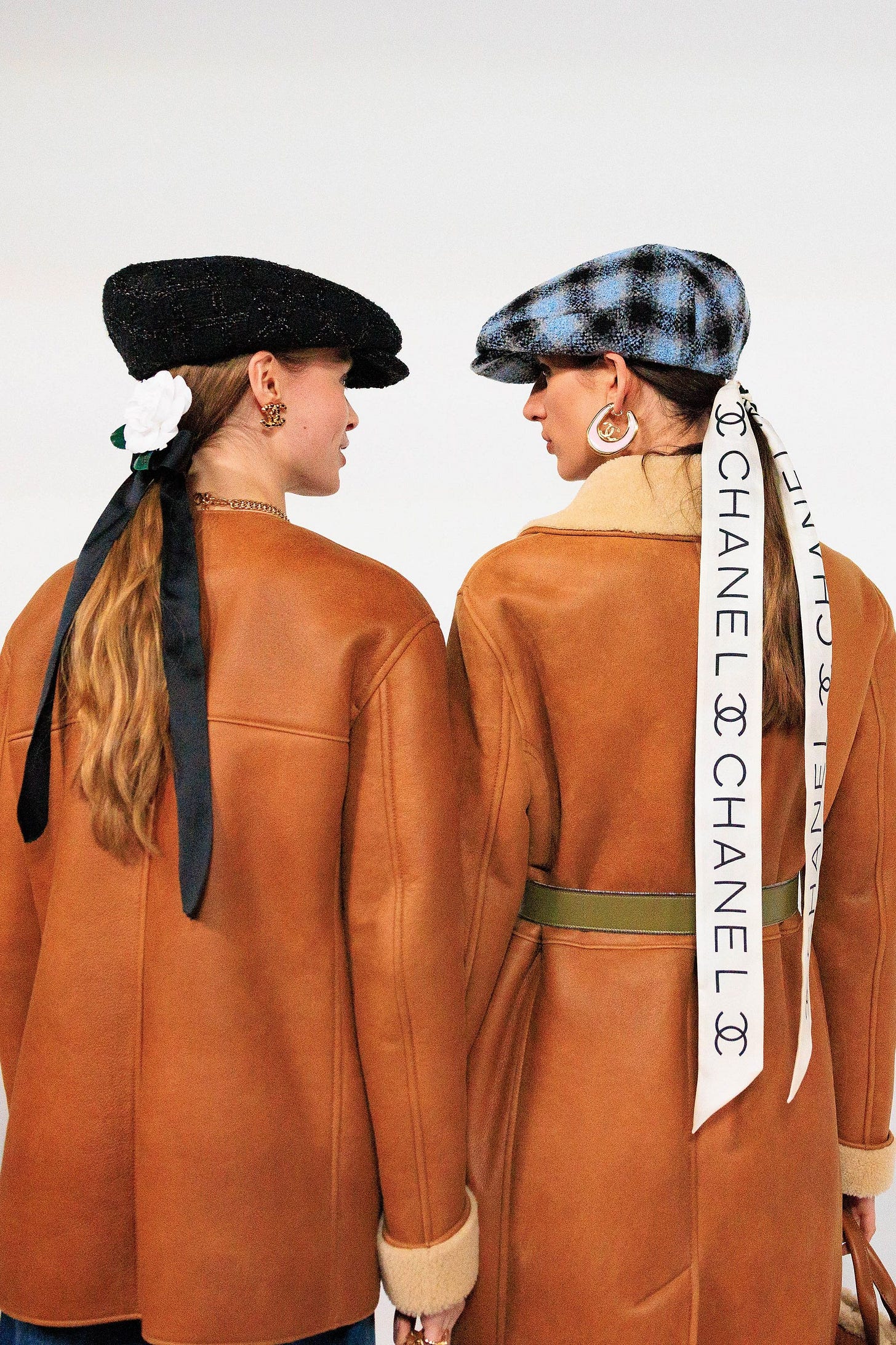 Image may contain Adult Person Clothing Long Sleeve Sleeve Hat Accessories Jewelry Necklace Coat Bag and Handbag Image may contain Adult Person Clothing Long Sleeve Sleeve Hat Accessories Jewelry Necklace Coat Bag and Handbag