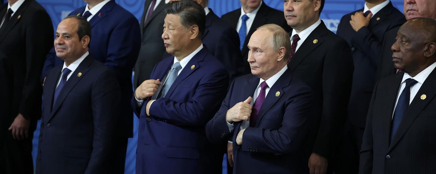 Russian President Vladimir Putin, Chinese President Xi Jinping and other attendees of the BRICS Summit in Kazan pose for a group photo. - Sputnik International, 1920, 28.10.2024