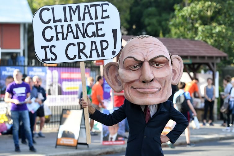 man dressed up as Tony Abbott climate denier