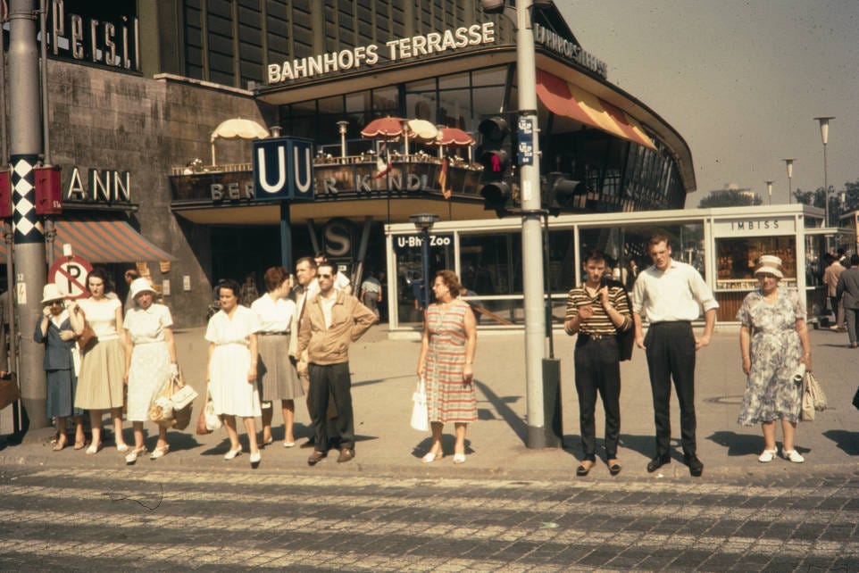 Germany, pedestrians waiting to cross Berlin street