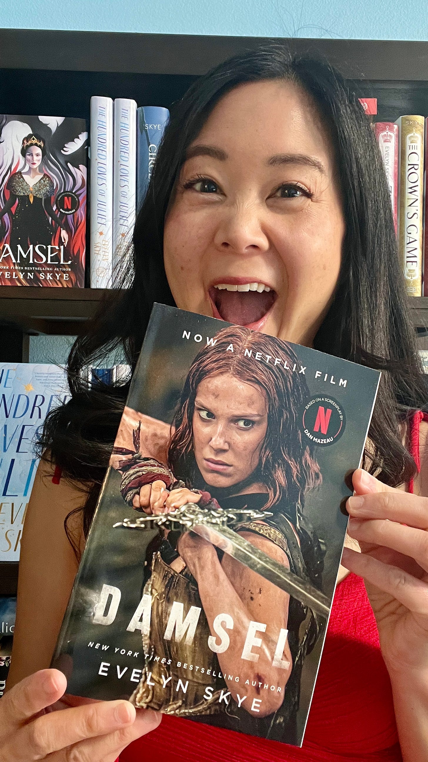 Author Evelyn Skye with a copy of DAMSEL