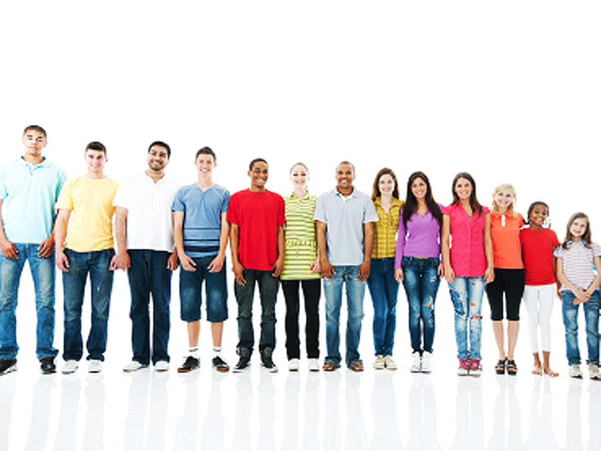 Photo of 11 teenagers and 2 children standing in order of height..