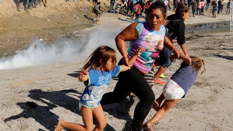 migrant woman fleeing with two children not fake news